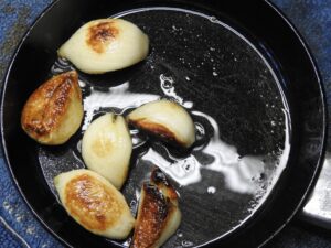 Garlic browning in pan